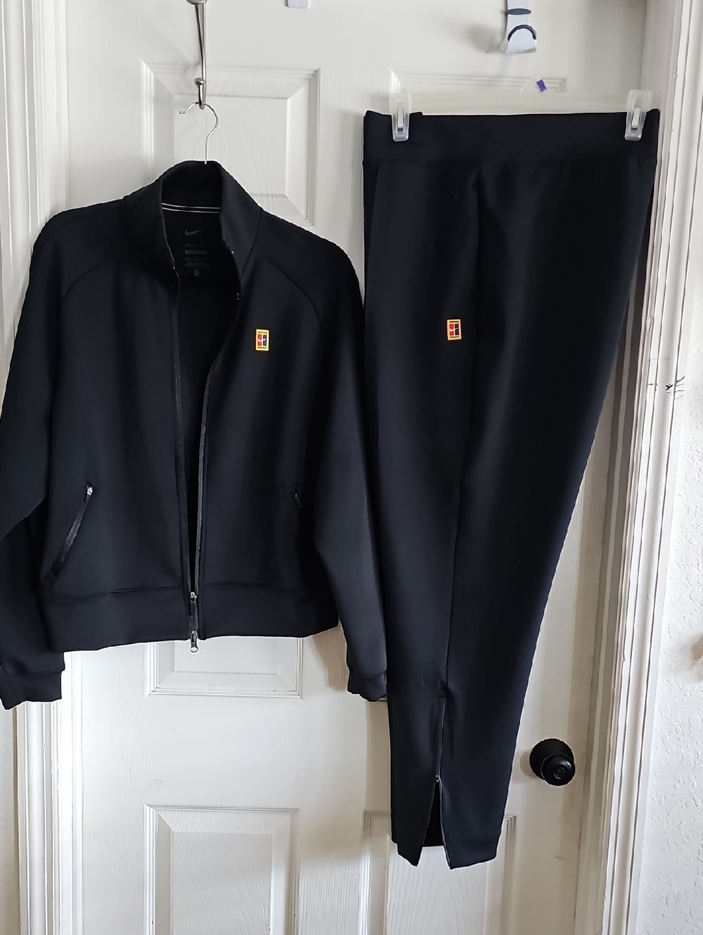 Nike Black Track Pants & Jacket Set with Small Red/Yellow Logo